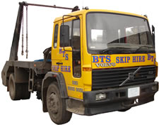 yellow skip lorry